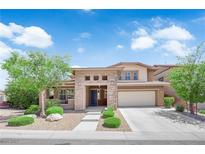 Charming two-story home with manicured landscaping and covered entryway, complete with a two car garage at 5542 Oak Bend Dr, Las Vegas, NV 89135
