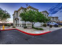 Charming two-story townhome with attached garage and landscaped front yard at 672 Solitude Point Ave, Henderson, NV 89012