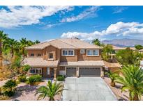 Inviting two-story home showcasing a well-maintained yard, mature palms, and a spacious two-car garage at 7340 Elderly Ave, Las Vegas, NV 89131
