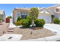 Charming single-story home featuring well-manicured landscaping and a tile roof at 8312 Raphael Ct, Las Vegas, NV 89129