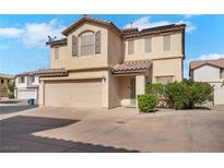 Charming two-story home featuring a two-car garage and a well-maintained front yard at 9053 Starling Wing Pl, Las Vegas, NV 89143