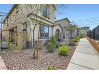 Charming two-story home with desert landscaping and sidewalk at 10650 Sariah Skye Ave, Las Vegas, NV 89166