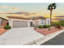 Charming single-story home featuring a two-car garage, mature landscaping, and inviting curb appeal at 10814 Franklin Hills Ave, Las Vegas, NV 89135
