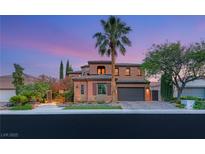 Elegant two-story home boasting mature palm trees and a well-manicured lawn at 11271 Winter Cottage Pl, Las Vegas, NV 89135