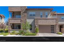 Beautiful townhome featuring a modern design, stone accents, two balconies and a two car garage at 11280 Granite Ridge Dr # 1009, Las Vegas, NV 89135