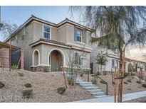 Inviting two-story home with stone accents, covered entry, and landscaped front yard in a desirable neighborhood at 1328 Graphite Ave, Henderson, NV 89002