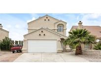 Charming two-story home with a well-manicured lawn and a two-car garage at 1345 Stokes St, Las Vegas, NV 89110