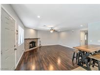 Bright living room with wood floors and a stone fireplace at 2708 Beaver Creek Ct # 202, Las Vegas, NV 89117