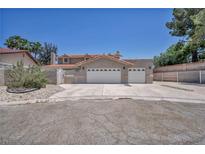 Charming two-story home featuring a spacious driveway and two-car garage under a bright blue sky at 3421 Rochelle Ct, Las Vegas, NV 89121