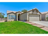 Charming single story home with a well-manicured lawn and a two car garage in a quiet neighborhood at 3622 Covewick Dr, North Las Vegas, NV 89032