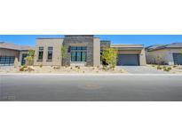 Stunning single-story home with a modern facade and drought-tolerant landscaping at 4750 Outlook Peak St, Las Vegas, NV 89135