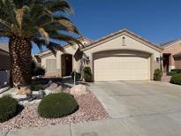 Charming single-story home with manicured landscaping, desert accents, and a convenient two-car garage at 495 Edgefield Ridge Pl, Henderson, NV 89012