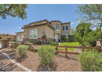 Inviting two-story home with stone accents and a well-manicured front yard at 6103 Sundown Crest St, Las Vegas, NV 89113