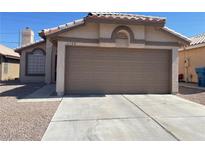 Charming single-story home featuring a two-car garage and low-maintenance desert landscaping at 6340 Cranberry Ln, Las Vegas, NV 89156