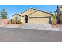 Charming single-story home featuring a two-car garage and a well-maintained front yard at 6360 Bullring Ln, Las Vegas, NV 89130