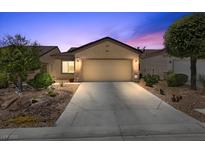 Charming single-story home with a well-maintained front yard and a two-car garage at 7817 Homing Pigeon St, North Las Vegas, NV 89084