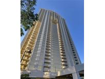 Stunning exterior view of a high-rise building with balconies and clear blue sky at 135 E Harmon Ave # 2303, Las Vegas, NV 89109