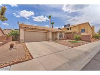 Charming single story home with desert landscaping and a two car garage at 1468 Harmony Hill Dr, Henderson, NV 89014