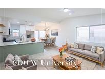Bright and airy living room featuring an open floor plan and modern furnishings at 6170 W University Ave, Las Vegas, NV 89103