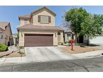 Charming two-story home with a well-maintained front yard and a two-car garage in a residential neighborhood at 7137 Eyebright St, Las Vegas, NV 89131