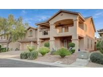 Charming two-story home featuring a balcony, well-manicured landscaping, and a two-car garage at 8093 Luna Sera Ave, Las Vegas, NV 89178