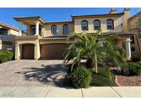Beautiful two-story home with a tile roof, balcony, manicured landscaping, and a spacious three-car garage at 6277 Mustang Spring Ave, Las Vegas, NV 89139