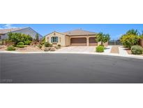 Charming single-story home featuring a two-car garage and well-maintained landscaping at 8298 W Agate Ave, Las Vegas, NV 89113