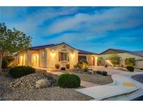 Charming single-story home with a well-manicured yard, stucco siding, and a tile roof at 8298 W Agate Ave, Las Vegas, NV 89113