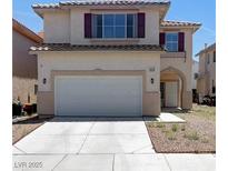 Charming two-story home featuring a two-car garage and desert landscaping at 8529 Gold Flash Ave, Las Vegas, NV 89129