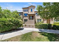 Inviting two-story home with well-maintained landscaping and charming architectural details at 11375 Ogden Mills Dr # 103, Las Vegas, NV 89135