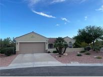 Charming single-story home featuring a desert landscape, large two-car garage, and inviting curb appeal at 1620 Fieldbrook St, Henderson, NV 89052