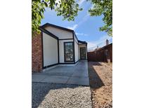 Charming single-story home showcasing modern architectural style with a brick accent and a well-maintained yard at 2318 El Molino Cir, Las Vegas, NV 89108