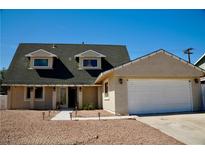 Charming single-story home with a two-car garage, beautiful front yard, and meticulous landscaping at 2659 Vegas Valley Dr, Las Vegas, NV 89121