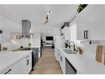 Bright kitchen features white cabinets, stainless steel appliances, and modern fixtures at 3509 Navajo Way, Las Vegas, NV 89108