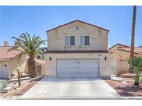 Charming two-story home with a well-maintained front yard and a two-car garage, perfect for a Gathering at 4428 Los Reyes Ct, Las Vegas, NV 89121