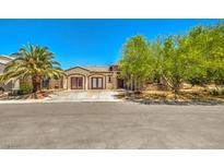 Charming single-story home featuring desert landscaping, a tile roof, and double door entry at 5396 Splendido Ave, Pahrump, NV 89061