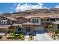 Beautiful two-story home with a landscaped front yard and mountain views at 5619 Shadow Bend Dr, Las Vegas, NV 89135