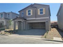 Charming two-story home featuring a spacious two-car garage and neutral color palette at 5736 Remy Rain St, Las Vegas, NV 89148