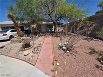 Charming home featuring a unique walkway and desert-style landscaping at 7108 Moon Ct, Las Vegas, NV 89145