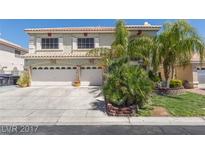Charming two-story home featuring a three-car garage, desert landscaping and tiled roof at 8208 Antler Ridge Ave, Las Vegas, NV 89149