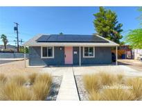 Charming single-story home with solar panels and a light pink front door at 920 Biltmore Dr, Las Vegas, NV 89101
