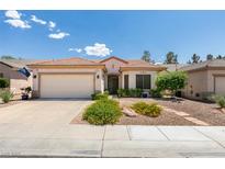 Charming single-story home featuring a xeriscaped front yard and two-car garage at 2111 Tiger Links Dr, Henderson, NV 89012