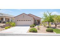 Charming single-story home featuring a well-manicured desert landscape and a two car garage at 2545 Divine Sky Dr, Henderson, NV 89044