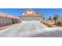 Charming two-story home featuring a three-car garage and well-maintained landscaping at 690 Great Dane Ct, Henderson, NV 89052