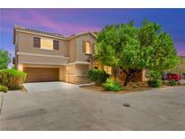 Charming two-story home features a well-manicured lawn and a spacious driveway leading to a two-car garage at 8316 Mokena Ave, Las Vegas, NV 89178