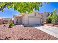 Charming single-story home with a two-car garage and desert landscaping at 1008 Welkin St, Henderson, NV 89052