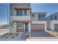 Modern two-story home boasts a two-car garage, desert landscaping, and contemporary design at 10184 Juniper Valley St, Las Vegas, NV 89166