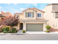 Charming two-story home with a two-car garage, desert landscaping, and a tile roof at 10717 Red Badge Ave, Las Vegas, NV 89166