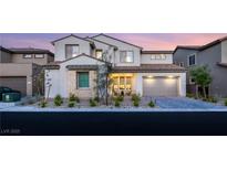 Charming two-story home boasting a tiled roof, neutral stucco, manicured landscaping, and a two car garage at 230 Cactus Sunrise St, Las Vegas, NV 89138