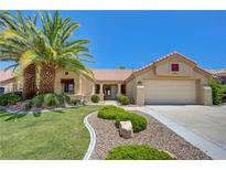 Charming single story home with mature landscaping including a beautiful palm tree in the front yard at 2808 Crown Ridge Dr, Las Vegas, NV 89134